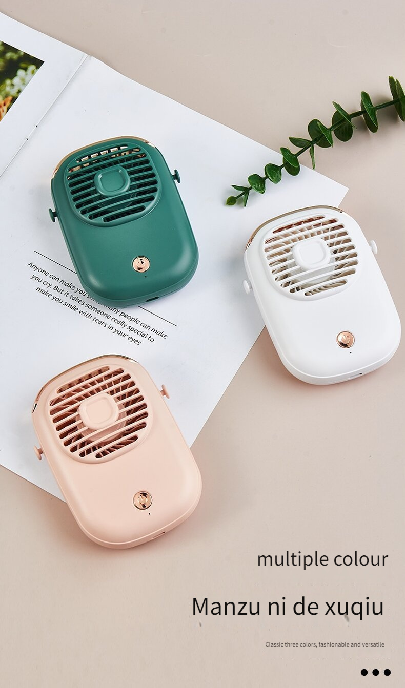 a portable silent handheld fan with a neck strap suitable for outdoor use it can be charged via usb the fan has no blades and comes in green white and pink colors it is a mini handheld fan details 7